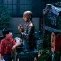 Japan - Tokyo -. Boy at statue of Buddha at Asakasa Temple.