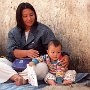 Burma - Mother and child selling limes