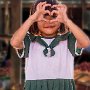 Myanmar- Inle lake market- school girl posing - 1