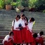 Thailand -Chiang mai - Girls releasing fish at Ping River to gain favor in a future life.