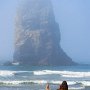 Oregon coast. Woman exercising on beach