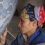 Woman painting vase, Vietnam�